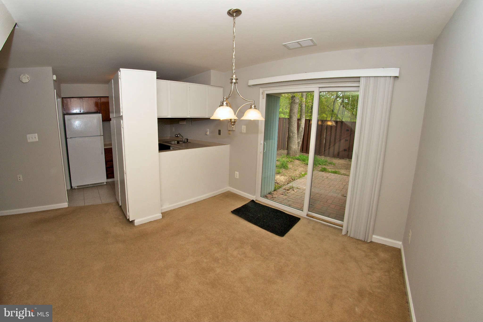 2211 Southgate Square Reston, VA 20191 - Photo 8 of 26 a kitchen that has a refrigerator and window