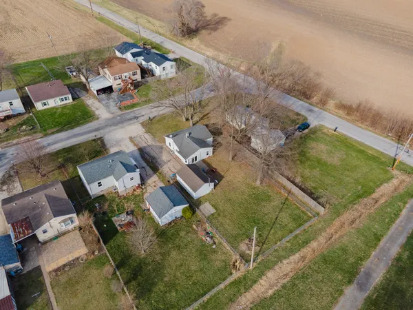 an aerial view of residential houses with outdoor space