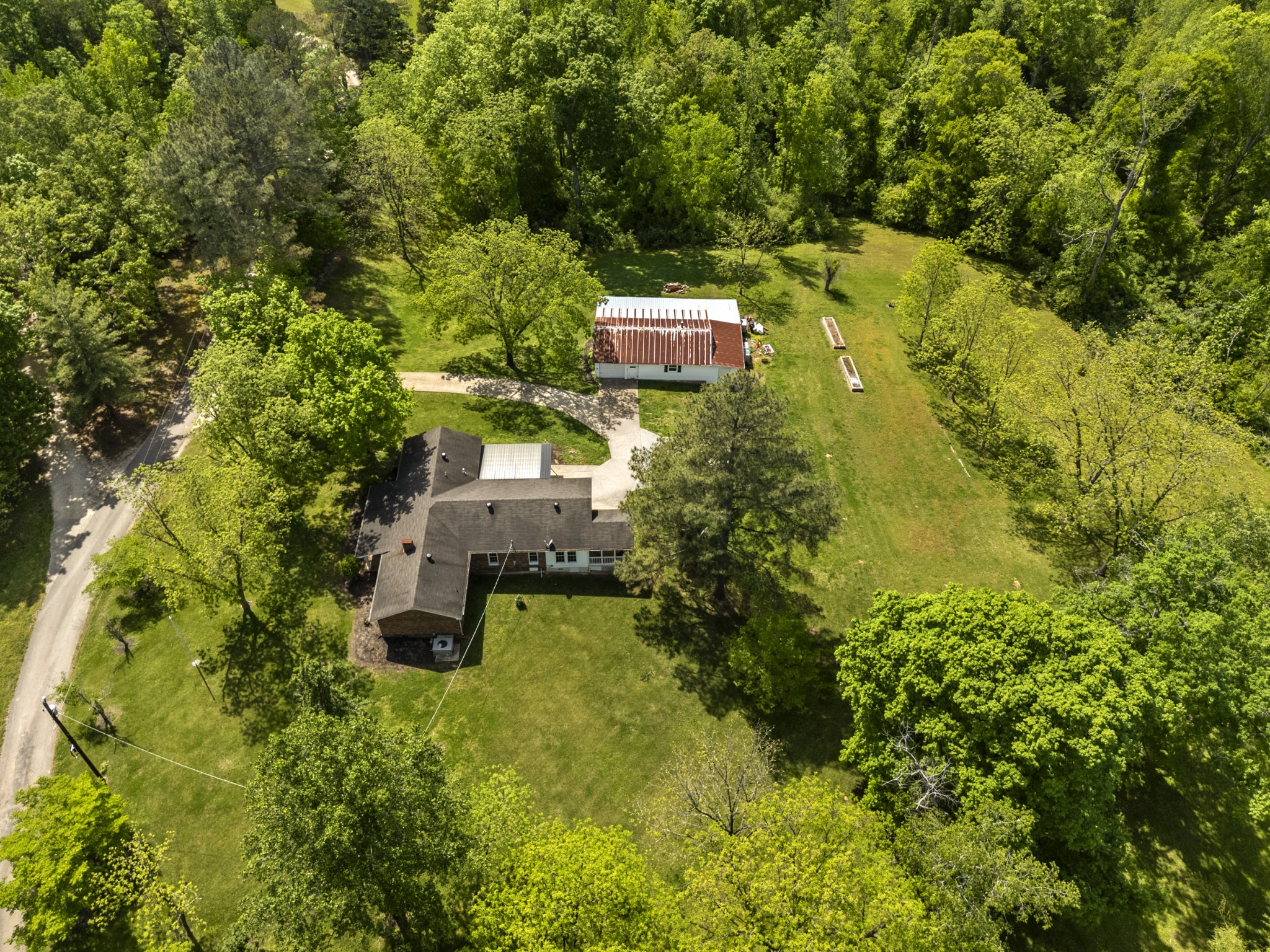 an aerial view of a house with a yard