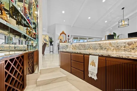 a utility room with sink dryer and washer
