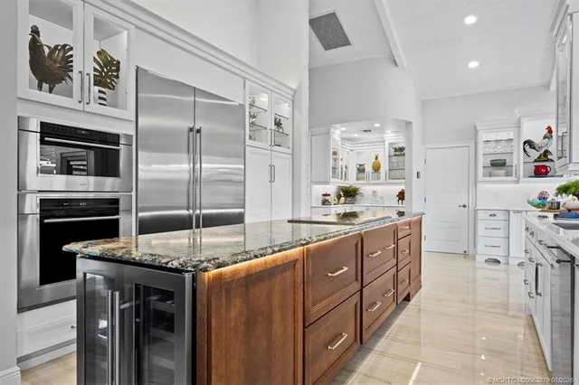 a living room with furniture a rug and a flat screen tv