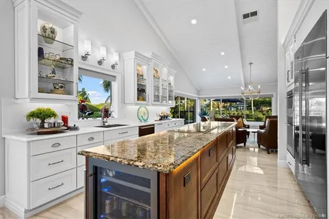 a bedroom with a bed a couch and a flat screen tv