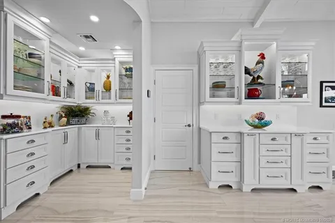 a bathroom with a double vanity sink mirror and shower