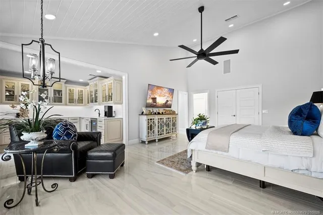 a view of a patio with a table and chairs under an umbrella