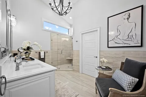 a view of a house with swimming pool and sitting area