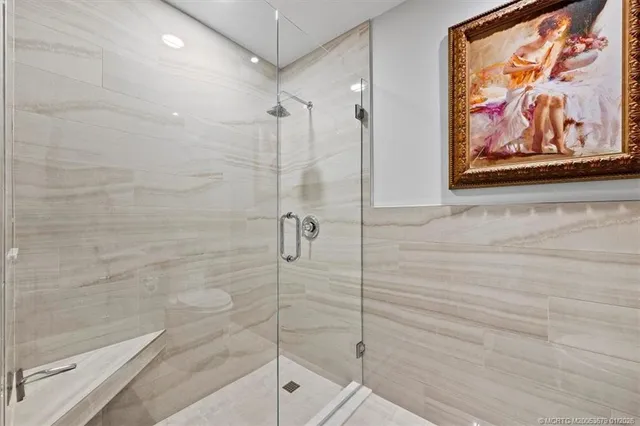a view of a patio with a table and chairs under an umbrella with a patio