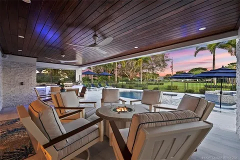 a view of a swimming pool with a patio