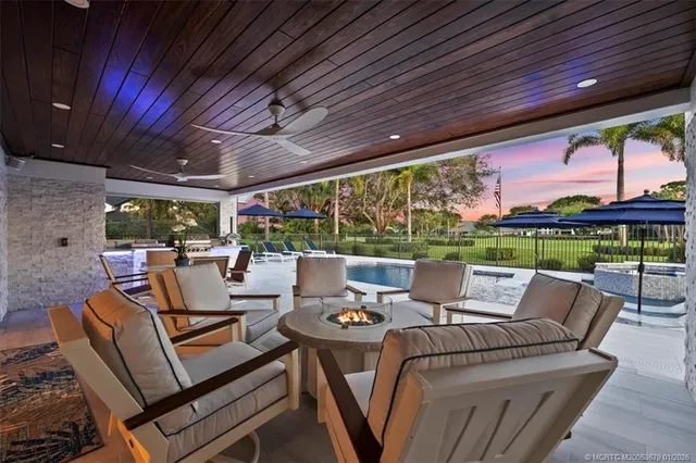 a view of a swimming pool with a patio