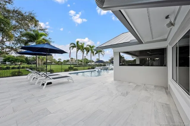 an aerial view of a house with a yard and garden