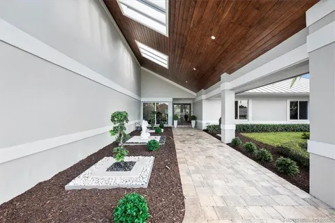 an aerial view of house with yard swimming pool and outdoor seating