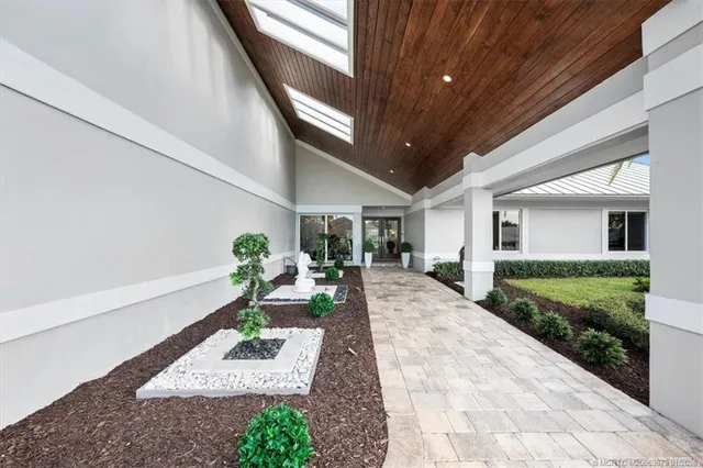 an aerial view of house with yard swimming pool and outdoor seating