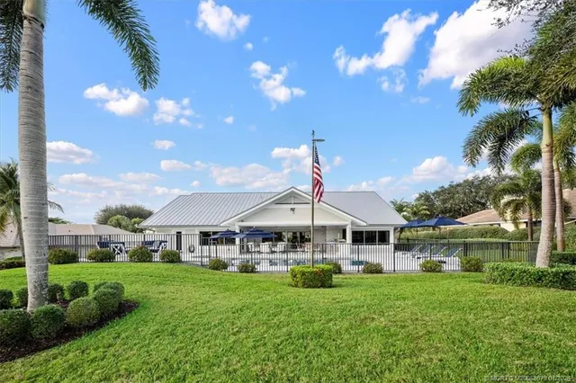 a dining room with furniture and chandelier