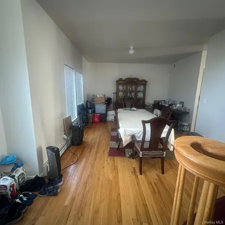 a view of a workspace with wooden floor