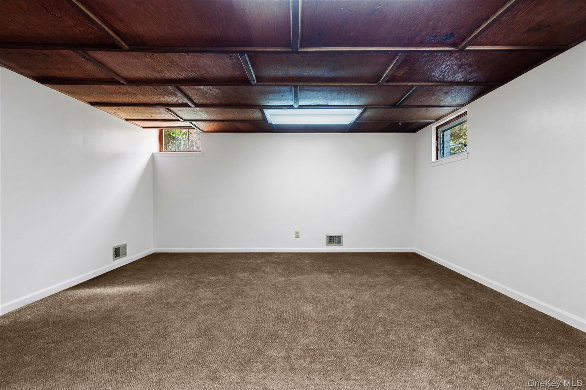 14 Loewen Court Rye, NY 10580 - Photo 17 of 25 Lower Level digitally staged with lighter walls and carpet