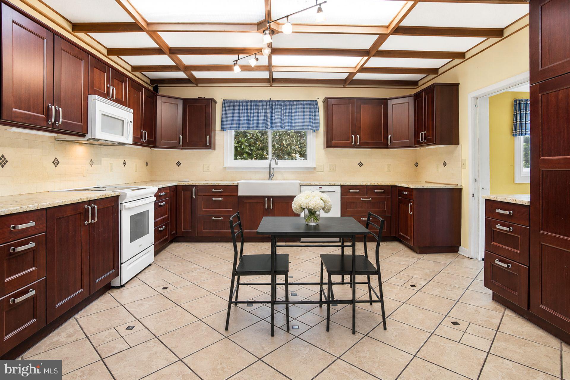 8965 Poorhouse Road Port Tobacco, MD 20677 - Photo 5 of 18 a kitchen with a sink a counter space cabinets and stainless steel appliances
