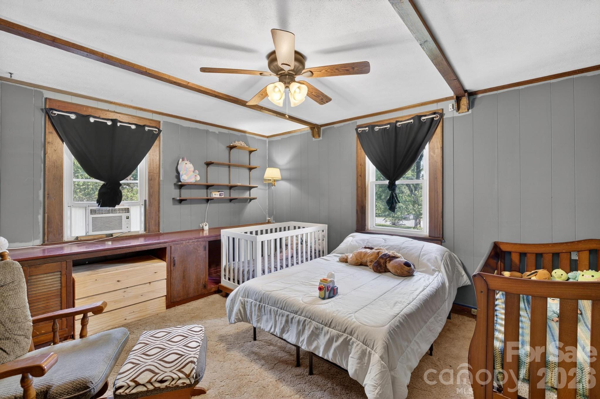 828 Jamestown Road Morganton, NC 28655 - Photo 13 of 36 a bedroom with furniture and a window