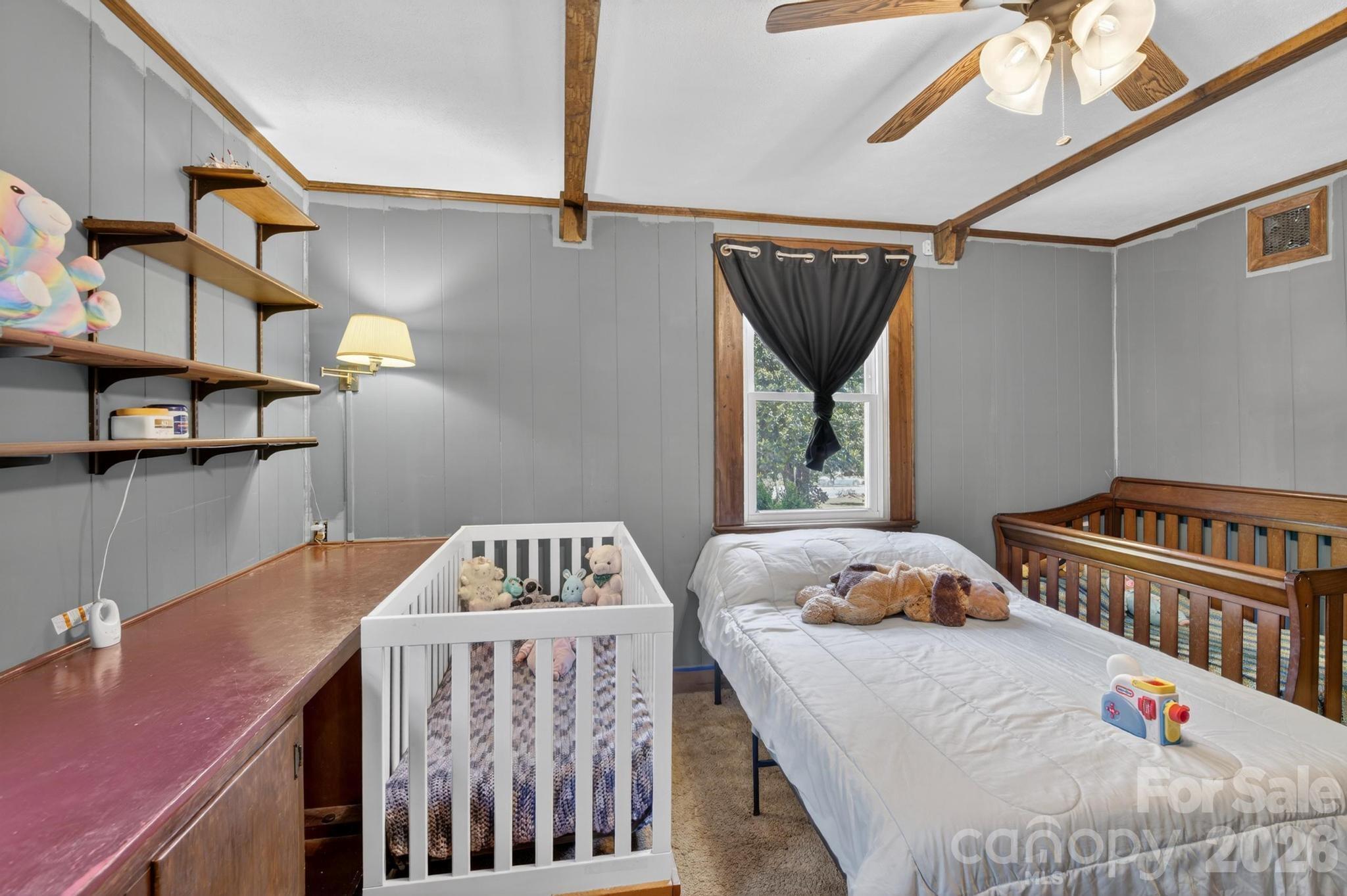 828 Jamestown Road Morganton, NC 28655 - Photo 14 of 36 a bedroom with a bed a window and dresser