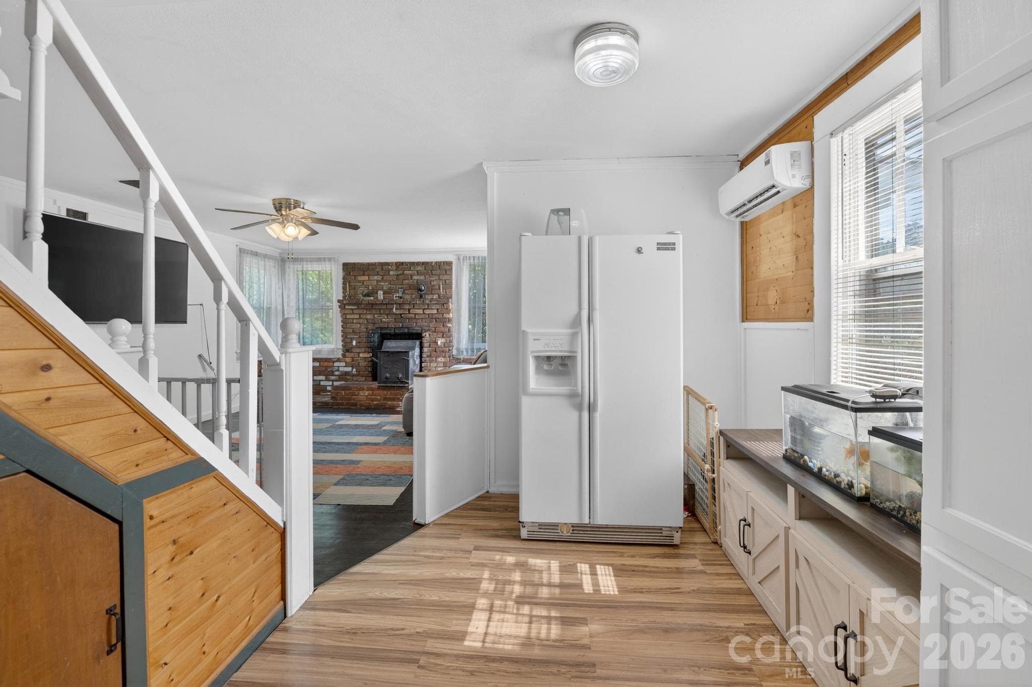 828 Jamestown Road Morganton, NC 28655 - Photo 18 of 36 a view of a hallway with wooden floor and staircase