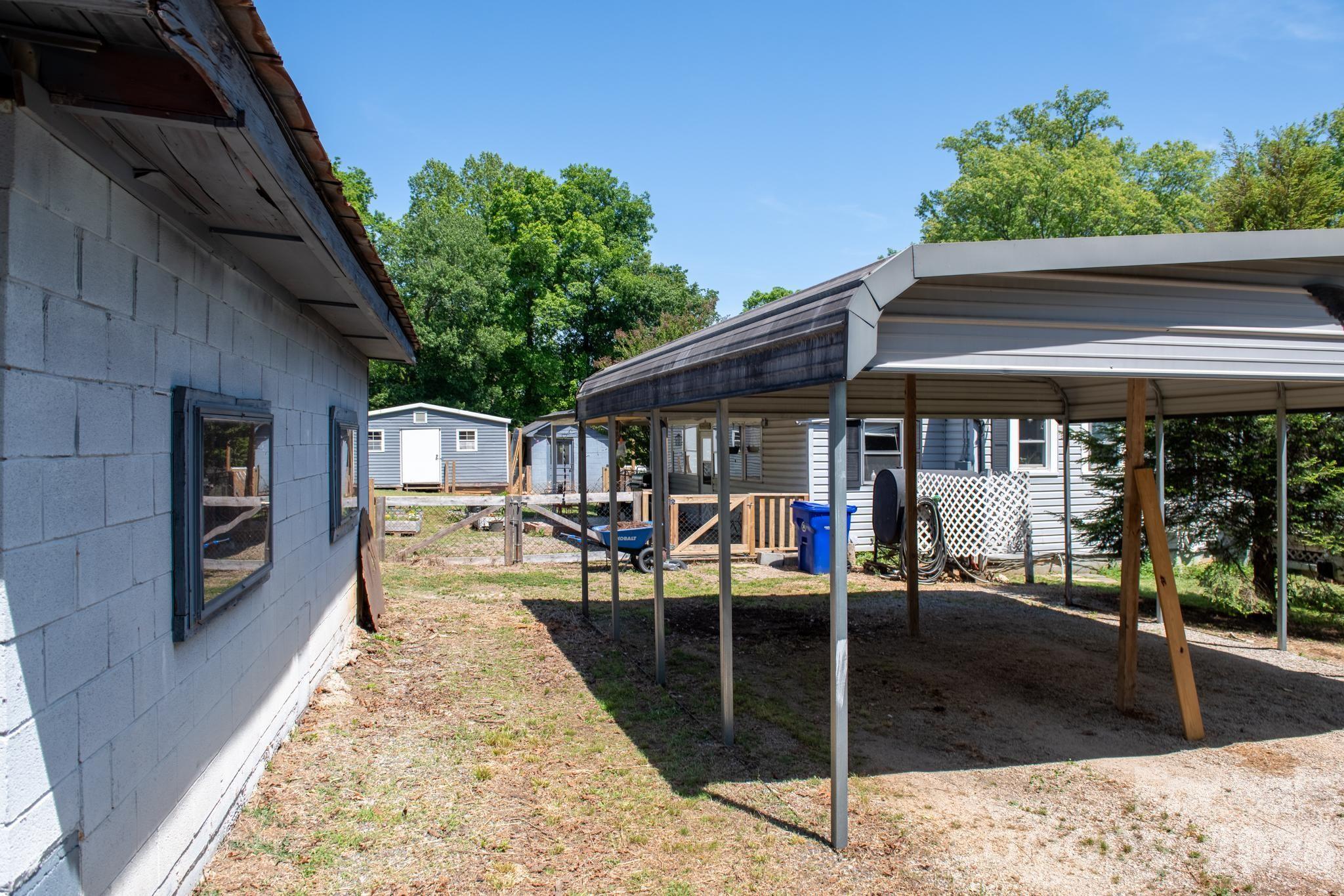 828 Jamestown Road Morganton, NC 28655 - Photo 29 of 36 a view of a house with backyard porch and sitting area