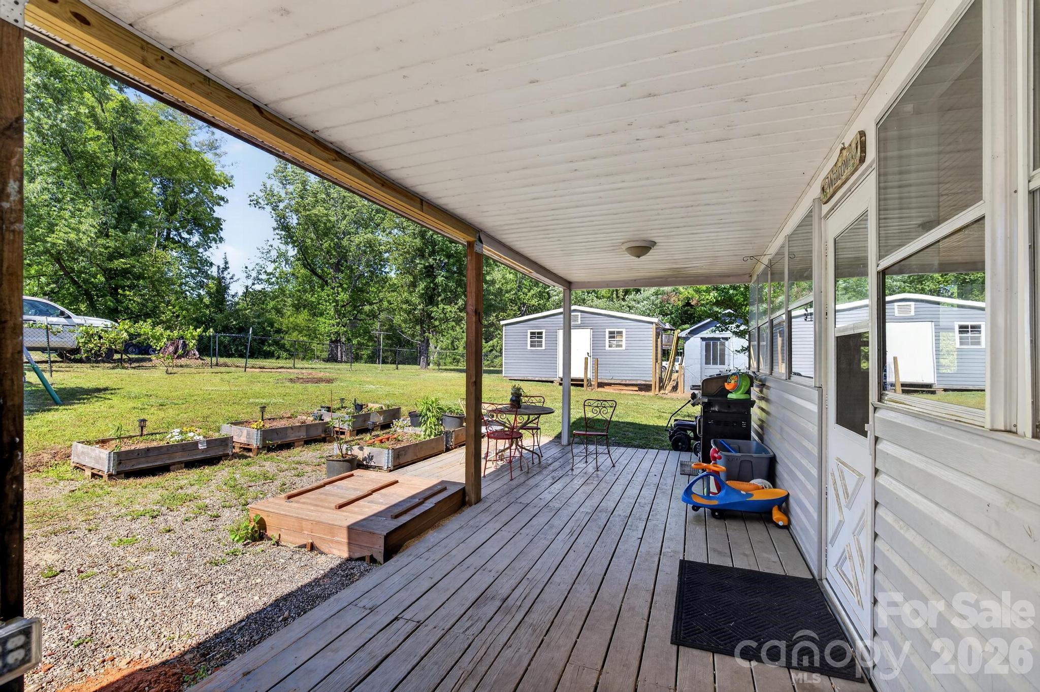 828 Jamestown Road Morganton, NC 28655 - Photo 31 of 36 a view of a living room and outdoor space