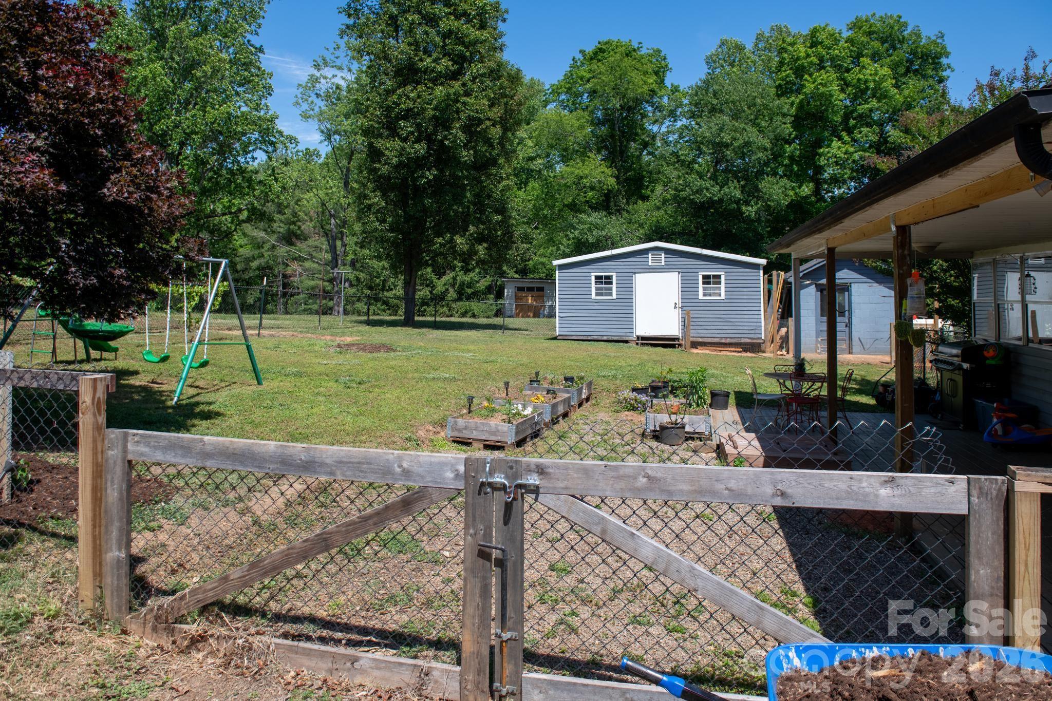 828 Jamestown Road Morganton, NC 28655 - Photo 34 of 36 a front view of a house with a yard