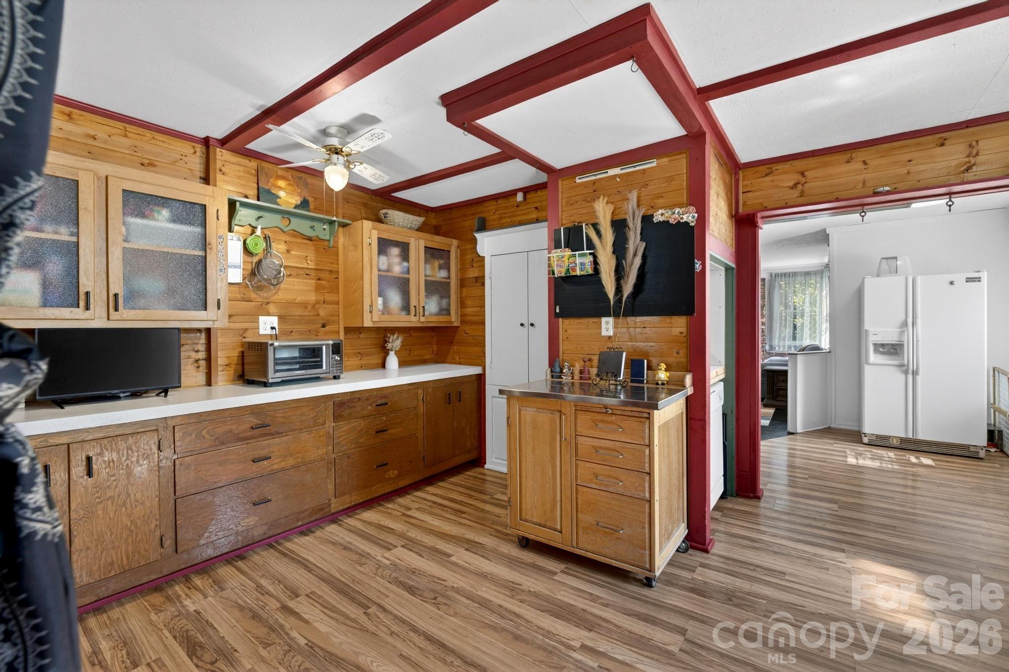 828 Jamestown Road Morganton, NC 28655 - Photo 5 of 36 a large kitchen with stainless steel appliances granite countertop a lot of counter space and wooden floors