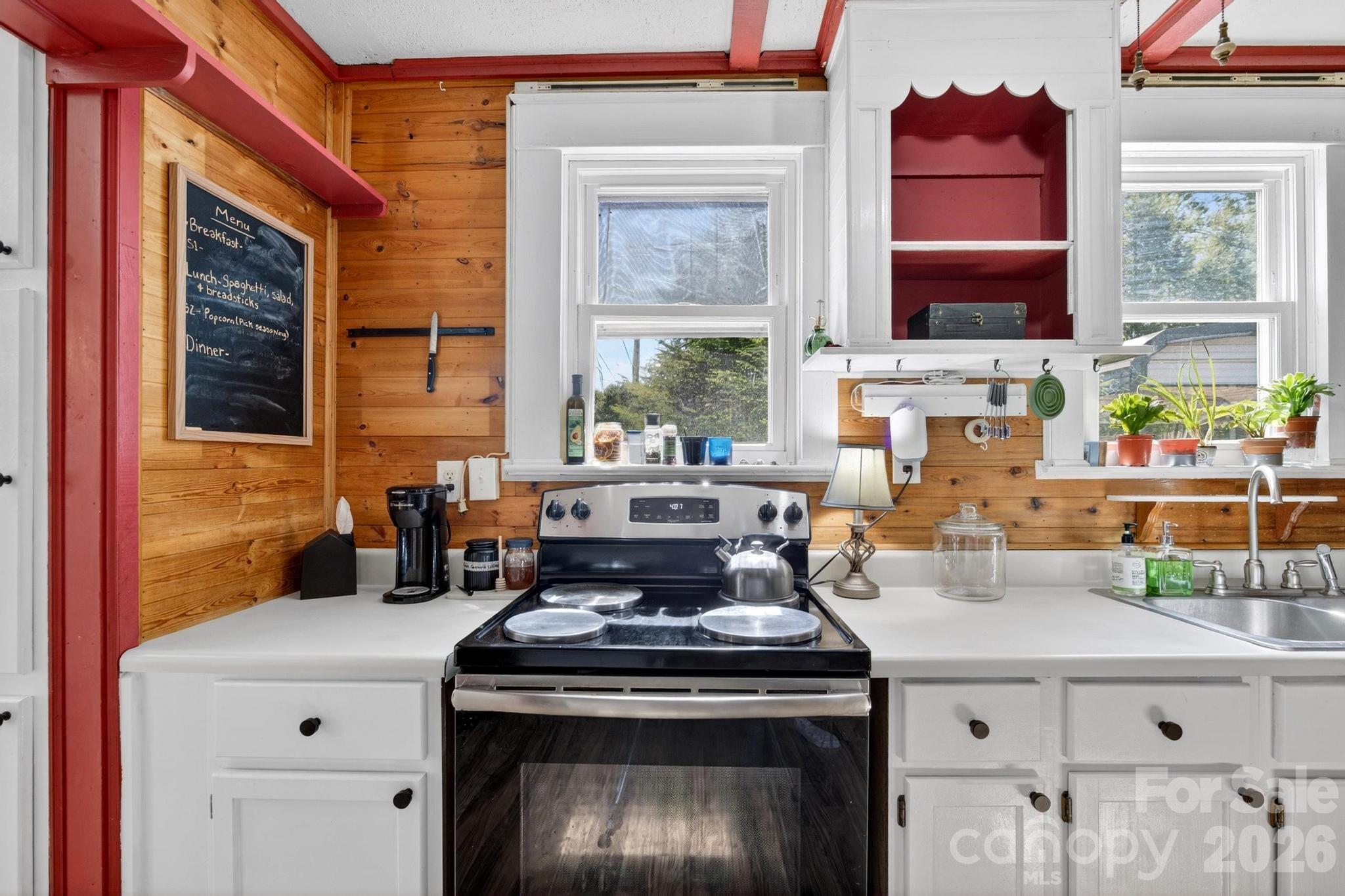 828 Jamestown Road Morganton, NC 28655 - Photo 8 of 36 a kitchen with a stove a sink and a window