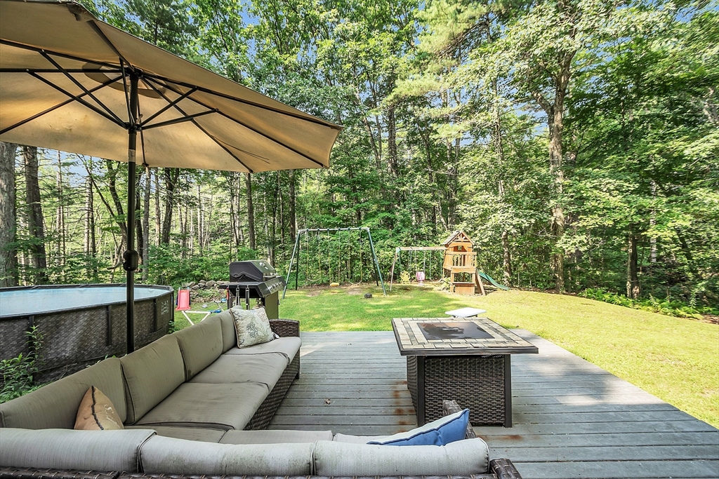 548 Reservoir Road Lunenburg, MA 01462 - Photo 8 of 34 a view of a backyard with swimming pool