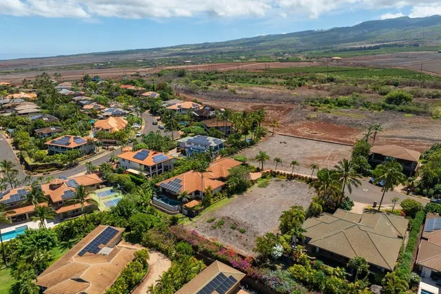 an aerial view of a city and ocean view