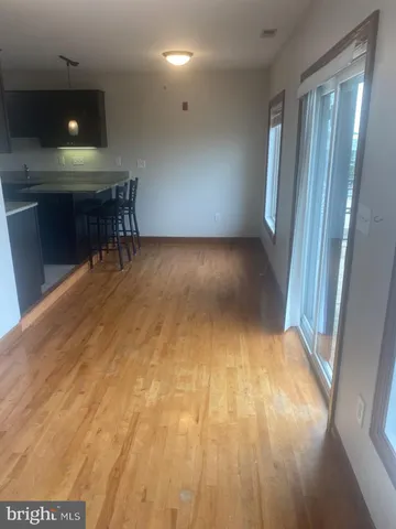 a view of a hallway with furniture