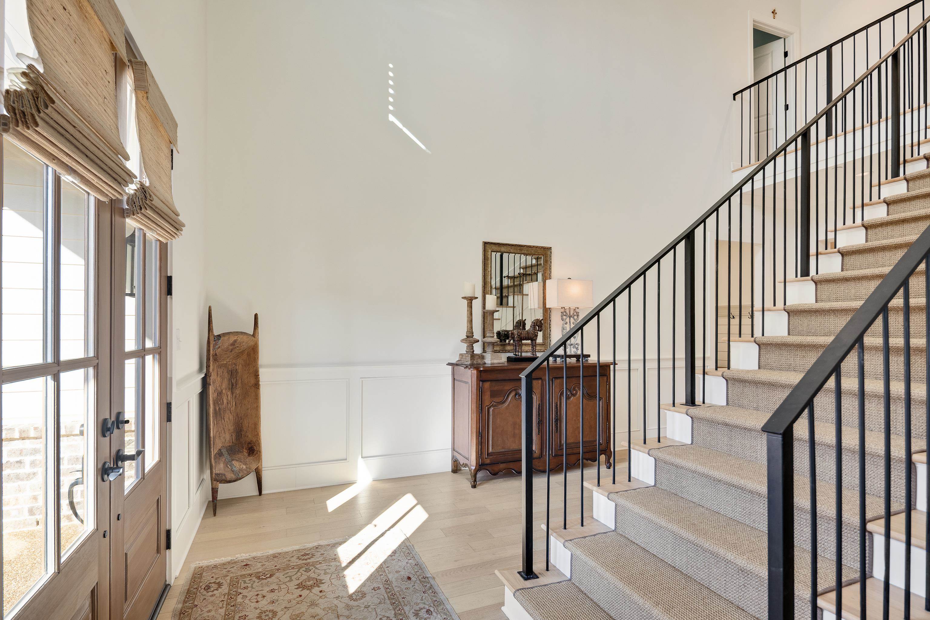 10138 Cliveden Circle South Collierville, TN 38017 - Photo 17 of 39 a view of staircase with lots of frames on wall and a large window