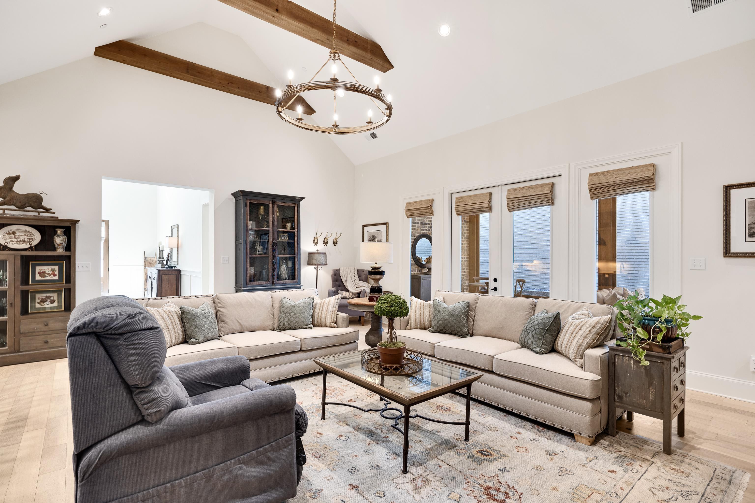10138 Cliveden Circle South Collierville, TN 38017 - Photo 18 of 39 a living room with furniture chandelier and a large window