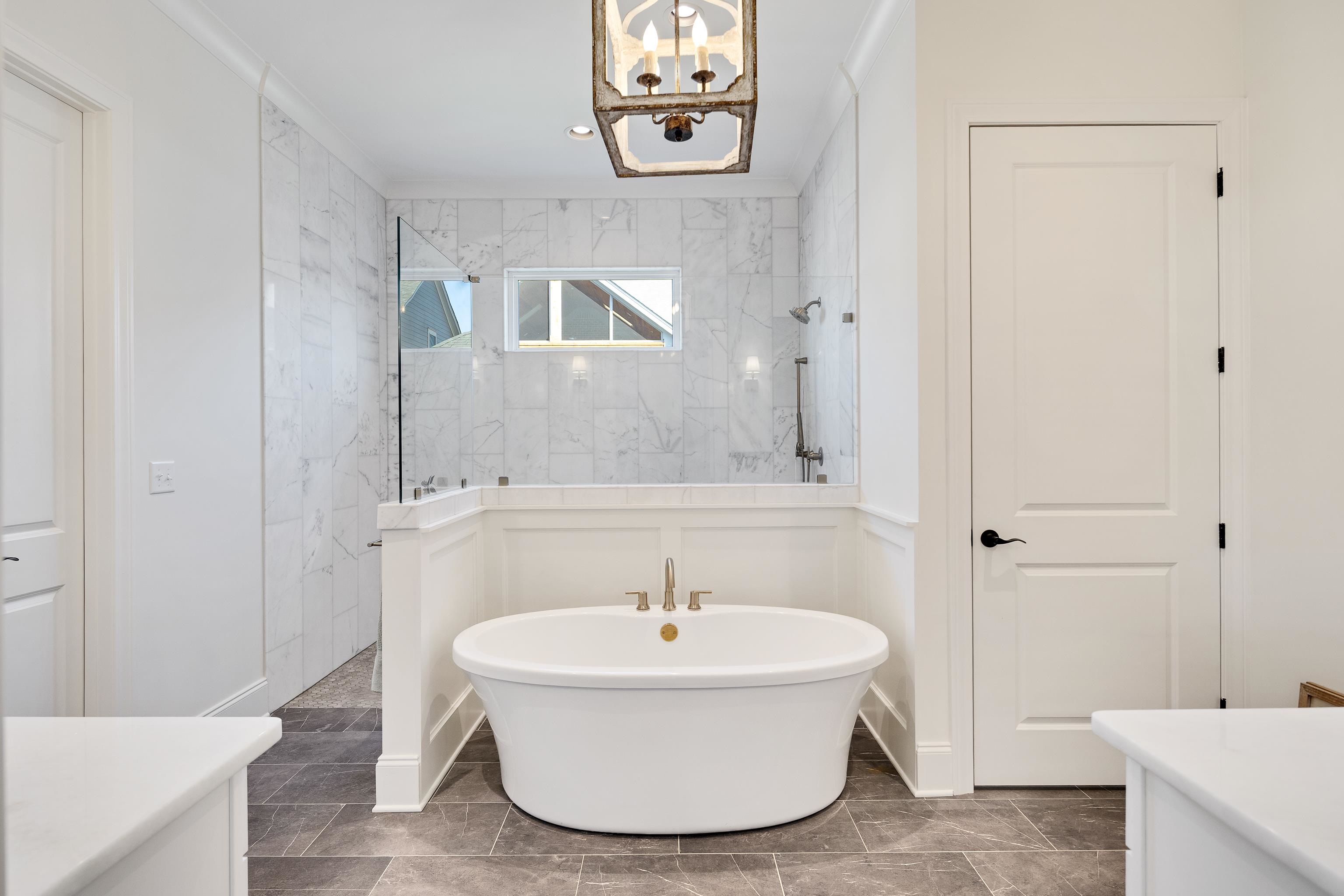 10138 Cliveden Circle South Collierville, TN 38017 - Photo 21 of 39 a bathroom with a tub and a sink