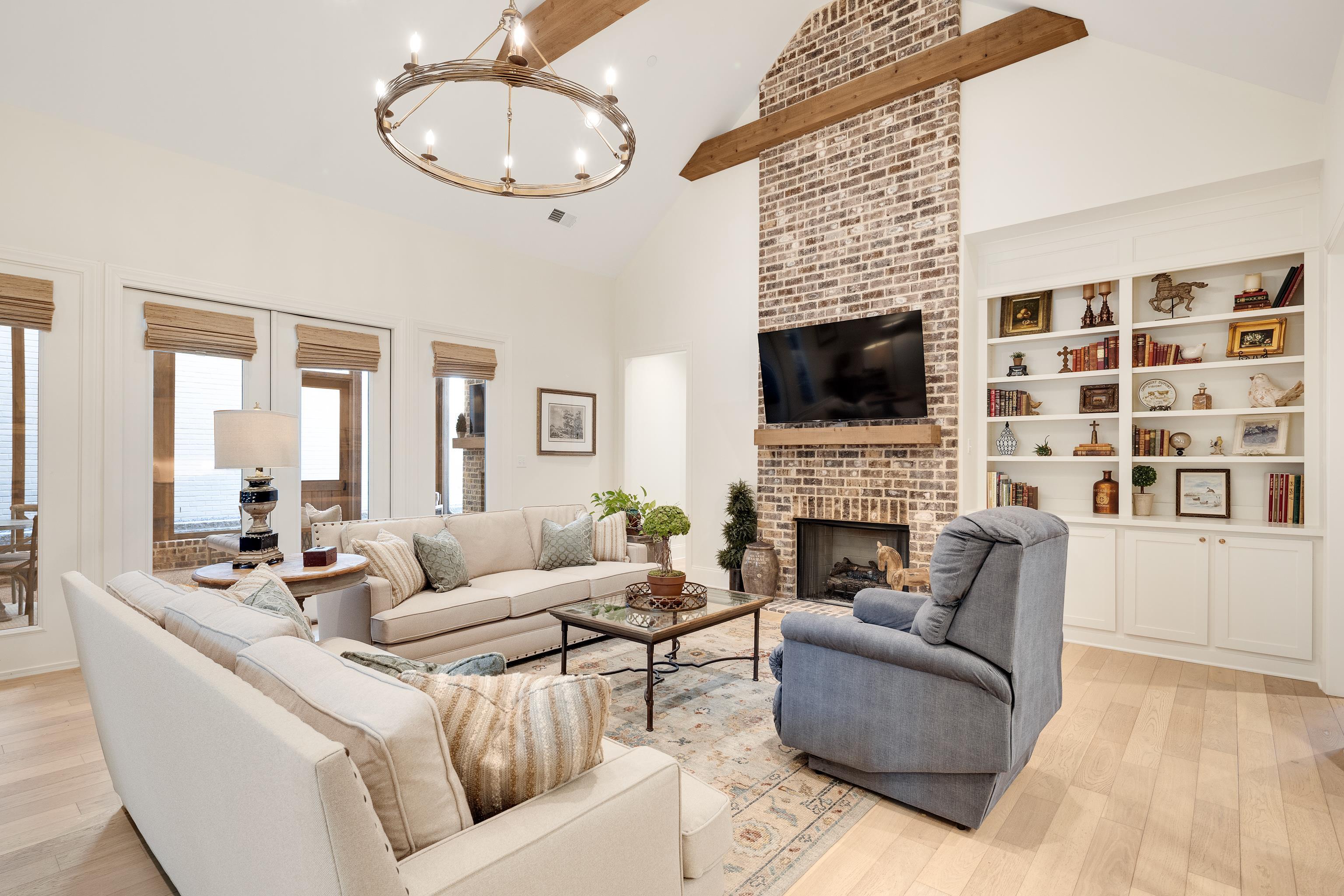 10138 Cliveden Circle South Collierville, TN 38017 - Photo 3 of 39 a living room with furniture a fireplace and a flat screen tv