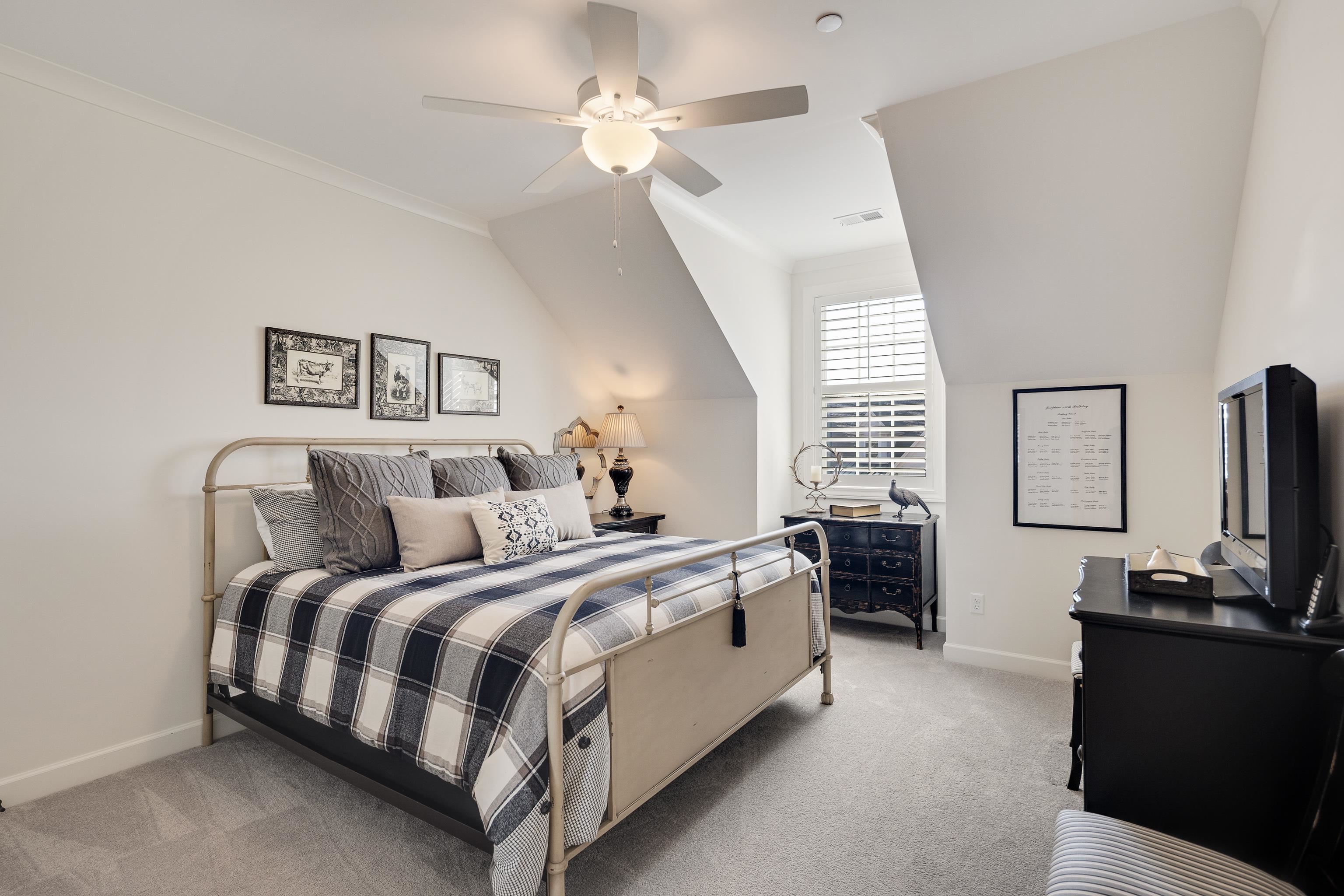 10138 Cliveden Circle South Collierville, TN 38017 - Photo 33 of 39 a spacious bedroom with a bed and a flat screen tv