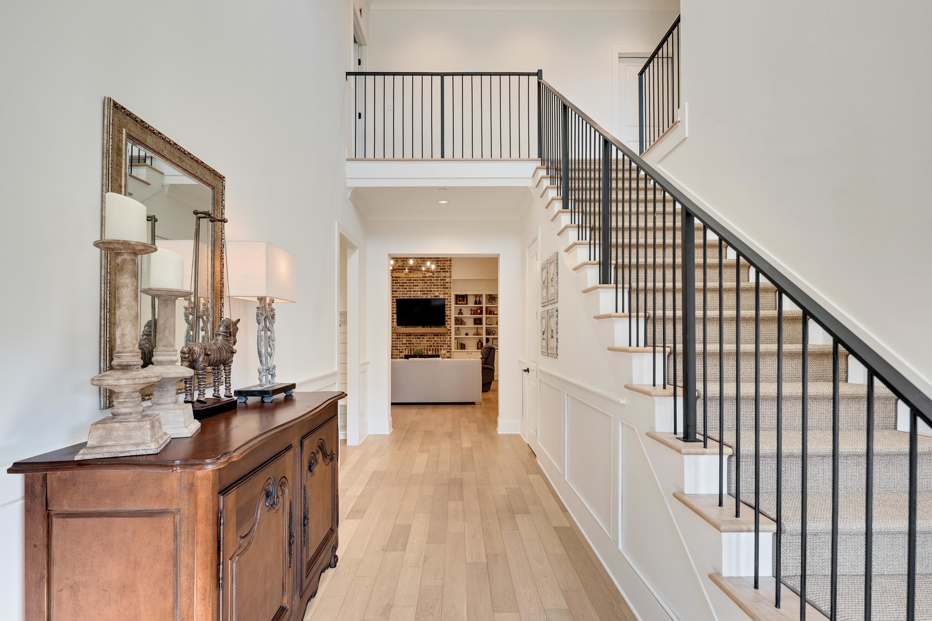 10138 Cliveden Circle South Collierville, TN 38017 - Photo 4 of 39 a view of a hallway with wooden floor and staircase