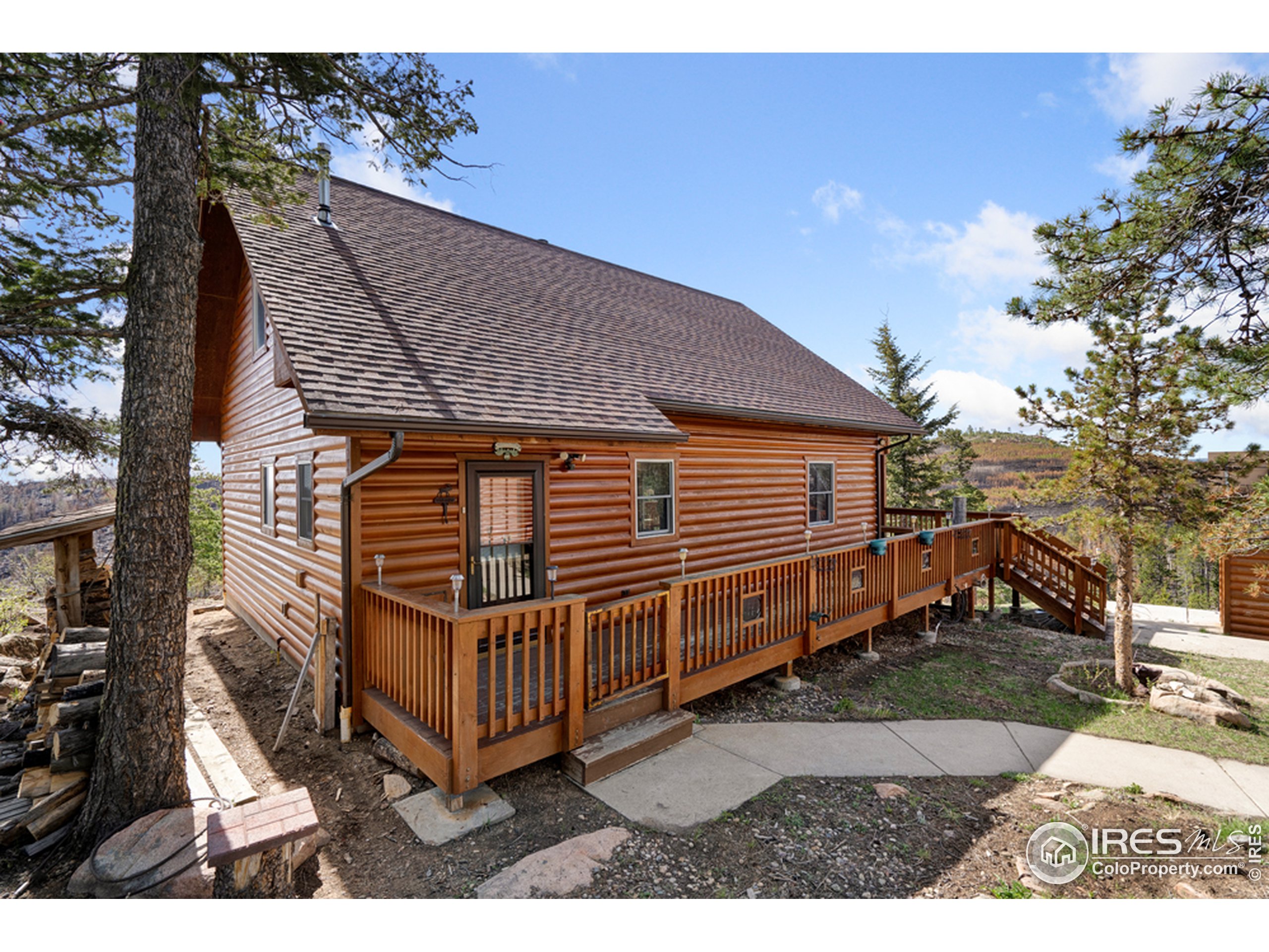 1075 Meadows Drive Drake, CO 80515 - Photo 15 of 30 a view of a house with a yard