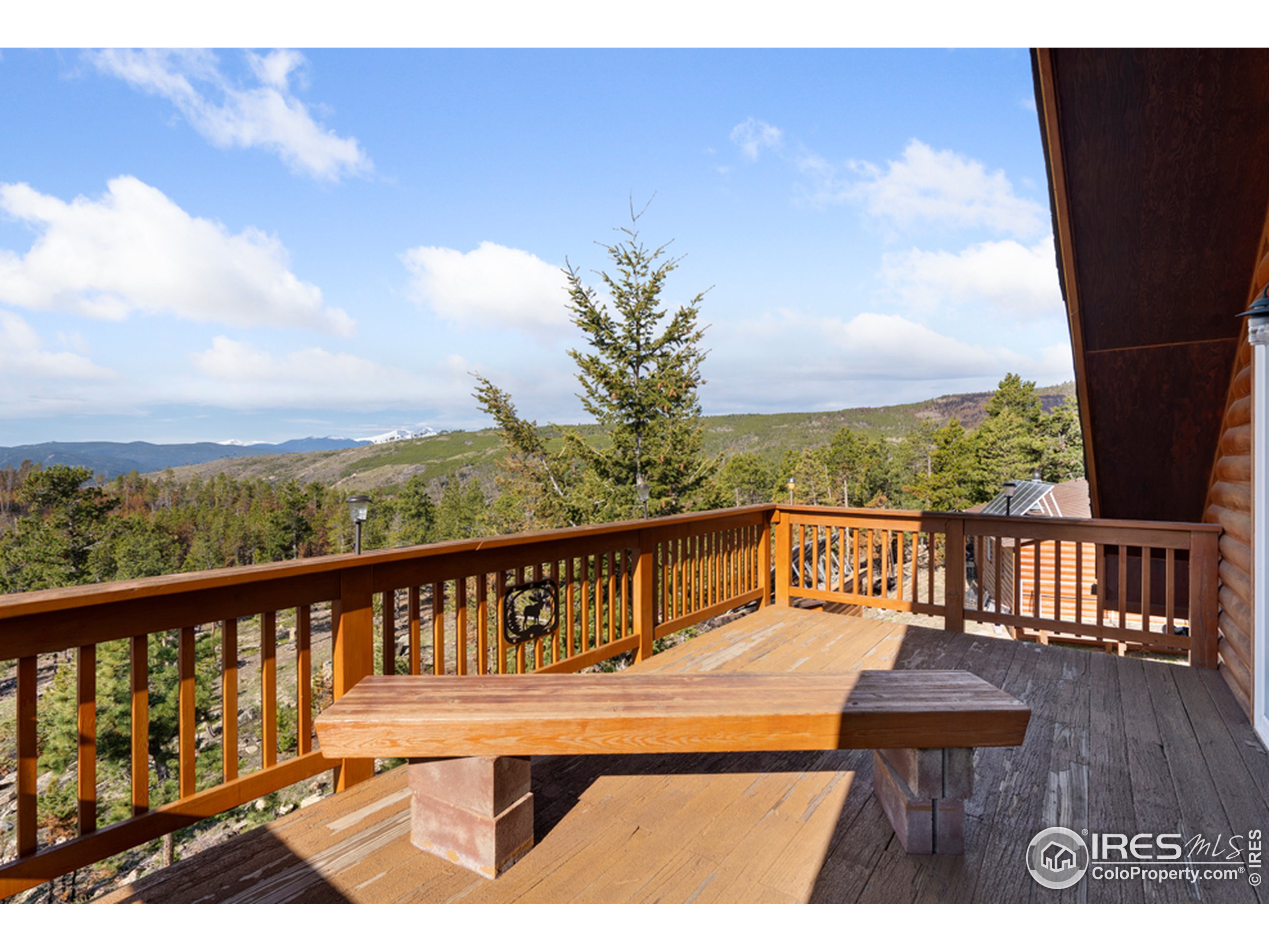 1075 Meadows Drive Drake, CO 80515 - Photo 20 of 30 a view of a balcony with wooden chairs