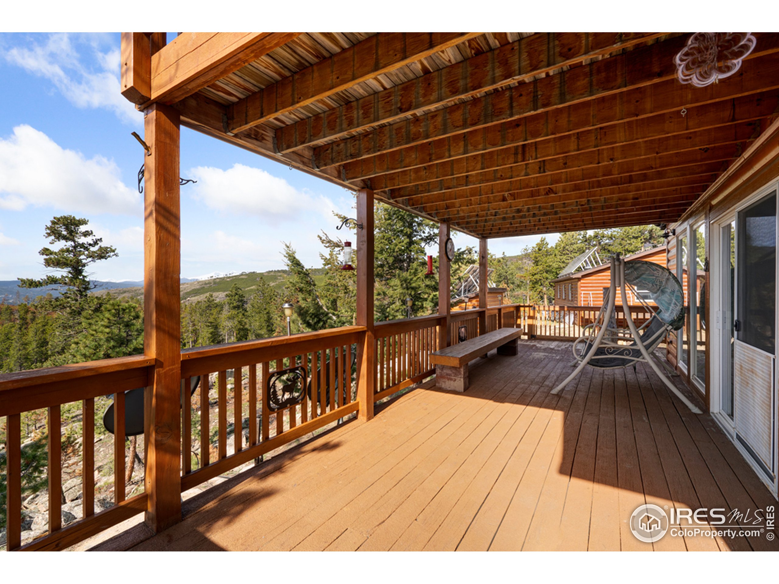 1075 Meadows Drive Drake, CO 80515 - Photo 5 of 30 a view of balcony with chairs and wooden floor