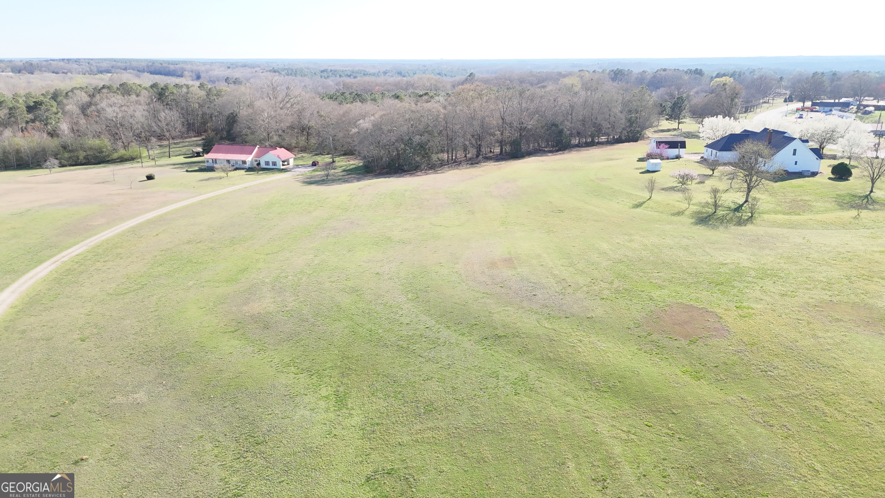 494 Broad Street Bowman, GA 30624 - Photo 60 of 65 a view of a lake with lawn chairs