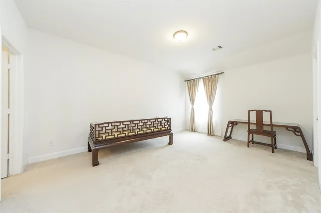 a view of workspace with furniture and window