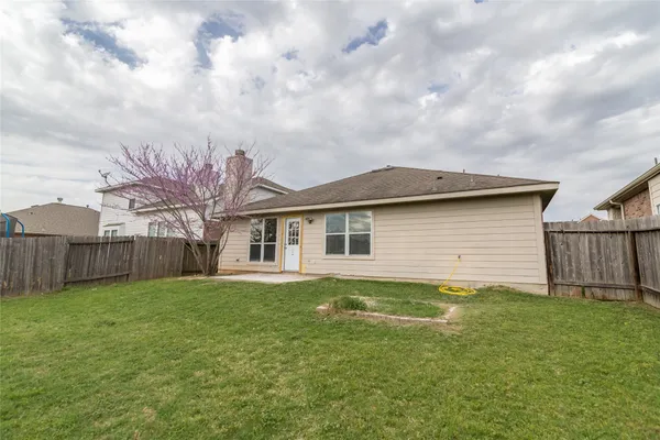 a view of backyard with green space