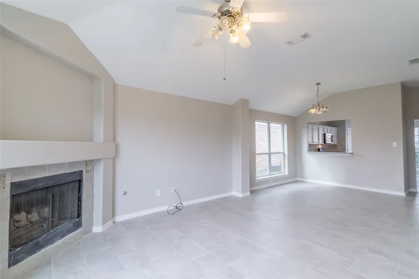 a view of an empty room with a fireplace