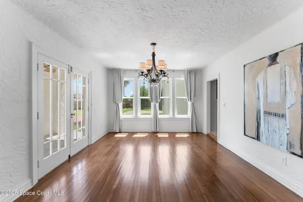 a kitchen with a table and chairs