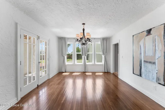 a view of a livingroom with furniture wooden floor and a window