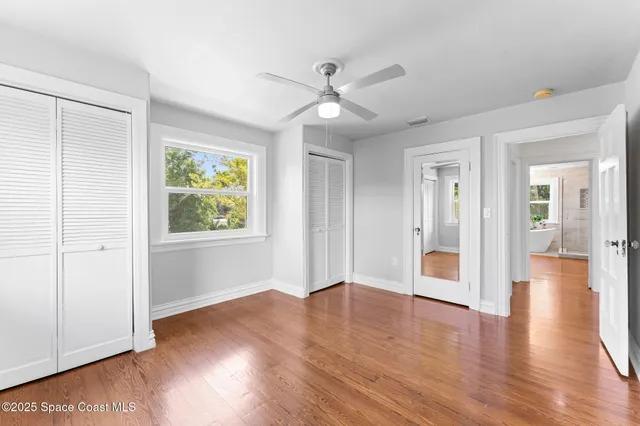 a kitchen with stainless steel appliances granite countertop a sink a stove and refrigerator