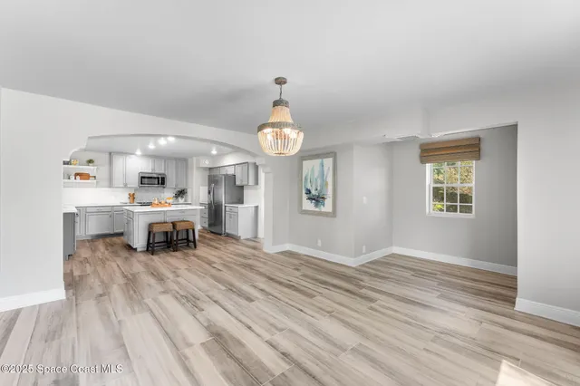 a view of entryway with wooden floor