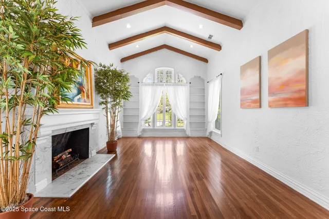a bathroom with a granite countertop sink a mirror and shower