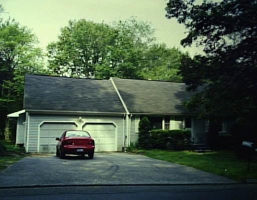 203 Fan Hill Road Monroe, CT 06468 - Photo 1 of 1 a car parked in front of a house