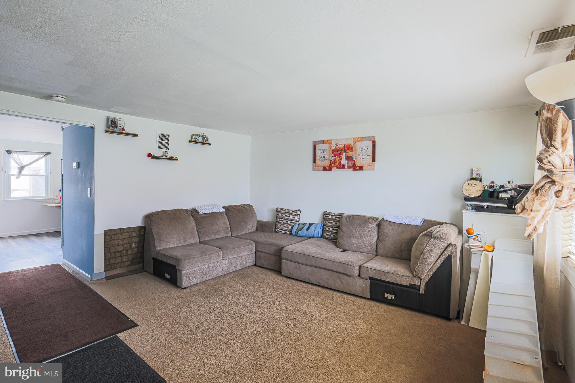 2707 Norfen Road Baltimore, MD 21227 - Photo 5 of 11 a living room with furniture and a couch